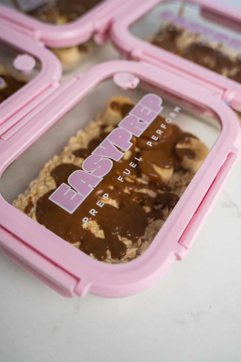 Pink Easy Prep containers with oats and banana
