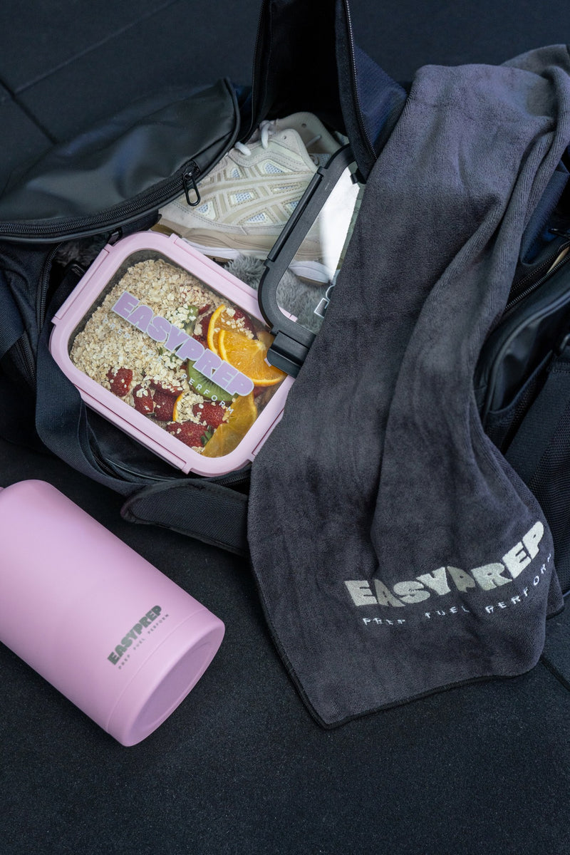 Pink Easy Prep container, bottle and towel packed for the day